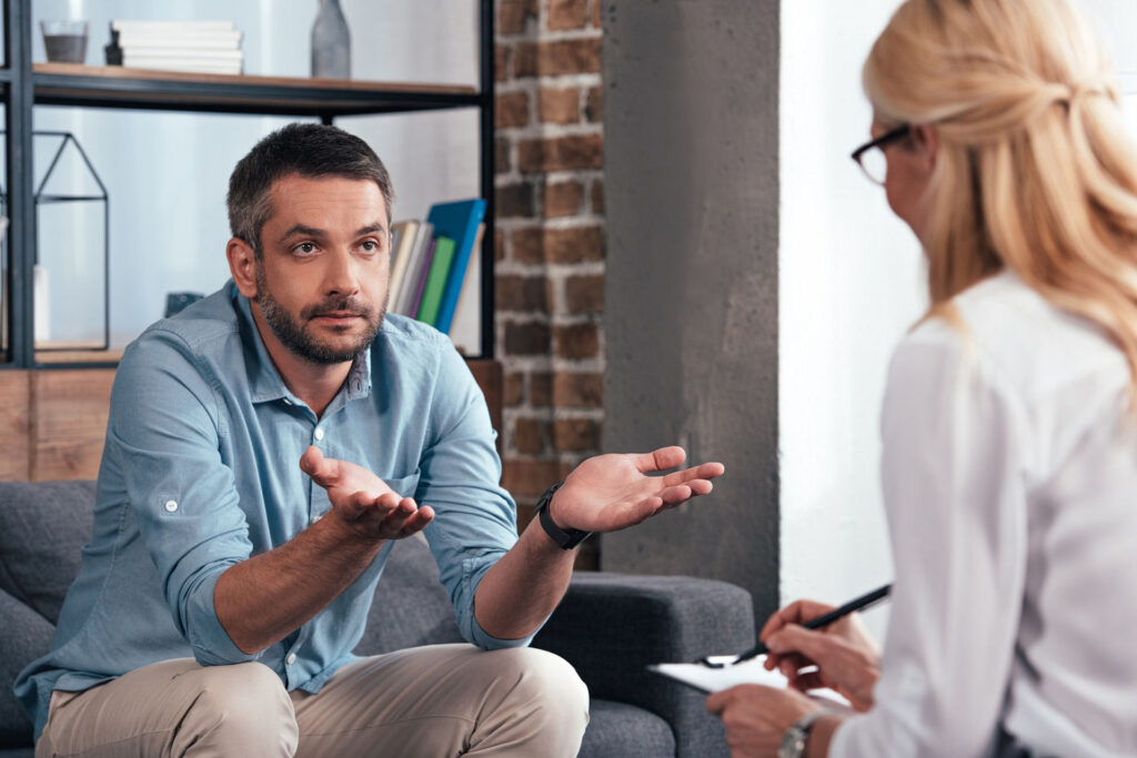 stressed man in therapy session