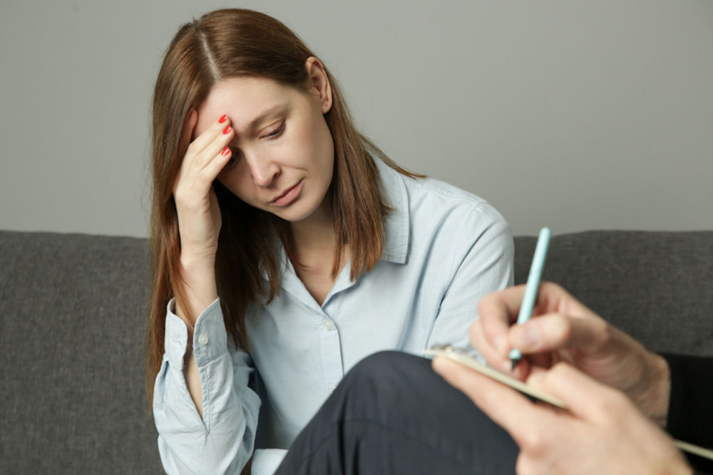 woman talking to therapist